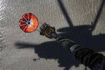 A U.S Marine Corps CH-53E Super Stallion from Marine Heavy Helicopter Squadron (HMH) 466, lowers a helicopter bucket into a lake during the Wildland Fire Fighting Exercise at MCB Camp Pendleton, Calif., April 30th, 2015. The exercise maintained the ability of HMH-466 to fight wildfires. 