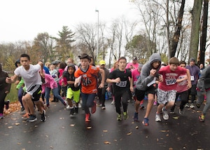 Hanscom Middle School students, parents and faculty participate in a two-mile Breast Cancer Awareness Run at Hanscom Air Force Base, Mass., Oct. 28. The annual event was the culmination of events organized by the HMS student council. (U.S. Air Force photo by Jerry Saslav) 