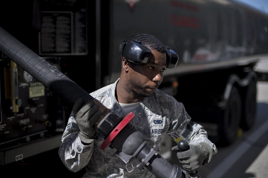 Senior Airman Justin Smith, 23d Logistics Readiness Squadron fuels distribution operator, extends a fuel hose, Oct. 25, 2016, at Moody Air Force Base, Ga. Annually, the fuel distribution section pumps approximately 6.3 million gallons of fuel to an assortment of aircraft. (U.S. Air Force photo by Airman 1st Class Daniel Snider)
