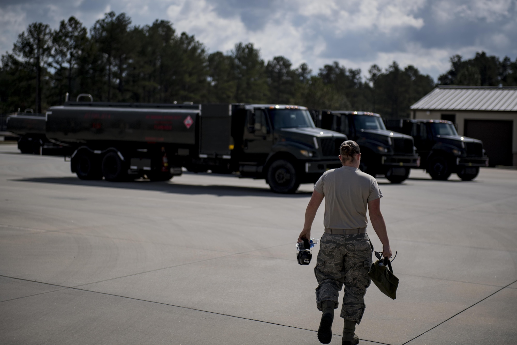 Airman 1st Class Courtney Herll, 23d Logistics Readiness Squadron fuels distribution operator, proceeds towards a R-11 refueling unit, Oct. 26, 2016, at Moody Air Force Base, Ga. The fuels distribution section is responsible for fueling all aircraft in Moody’s fleet along with all transient aircraft. (U.S. Air Force photo by Airman 1st Class Daniel Snider)