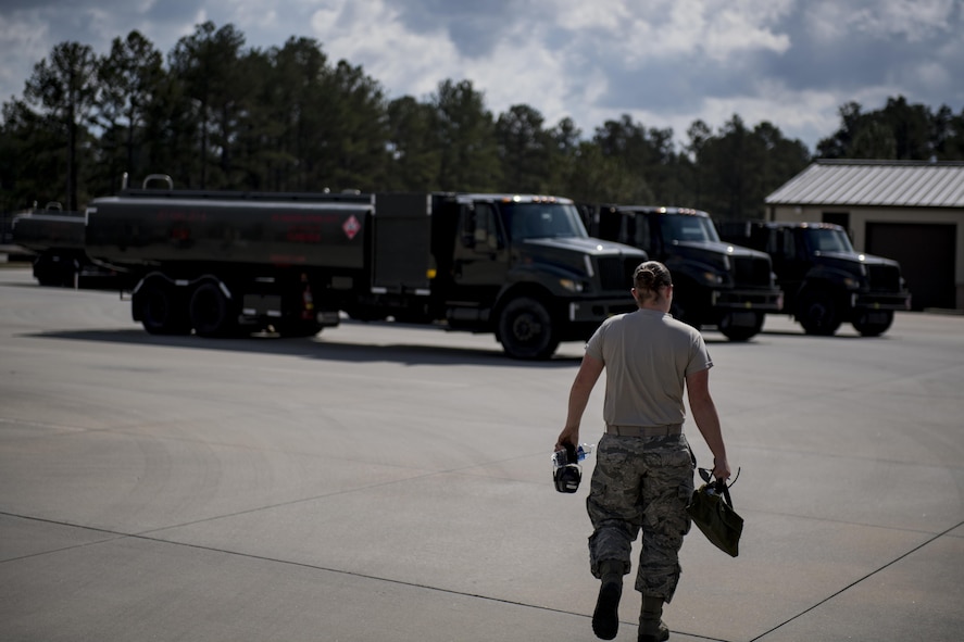 Airman 1st Class Courtney Herll, 23d Logistics Readiness Squadron fuels distribution operator, proceeds towards a R-11 refueling unit, Oct. 26, 2016, at Moody Air Force Base, Ga. The fuels distribution section is responsible for fueling all aircraft in Moody’s fleet along with all transient aircraft. (U.S. Air Force photo by Airman 1st Class Daniel Snider)