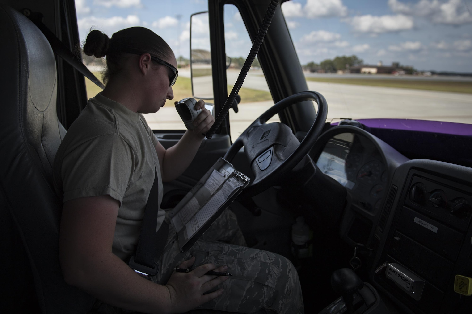 Airman 1st Class Courtney Herll, 23d Logistics Readiness Squadron fuels distribution operator, radios updates after performing A-10C Thunderbolt II hot refueling procedures, Oct. 26, 2016, at Moody Air Force Base, Ga. Herll’s fuel truck was able to refuel four A-10Cs with only brief pauses in-between. (U.S. Air Force photo by Airman 1st Class Daniel Snider)
