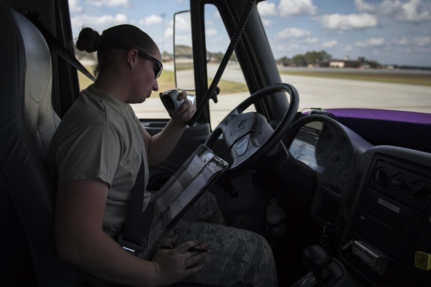 Airman 1st Class Courtney Herll, 23d Logistics Readiness Squadron fuels distribution operator, radios updates after performing A-10C Thunderbolt II hot refueling procedures, Oct. 26, 2016, at Moody Air Force Base, Ga. Herll’s fuel truck was able to refuel four A-10Cs with only brief pauses in-between. (U.S. Air Force photo by Airman 1st Class Daniel Snider)