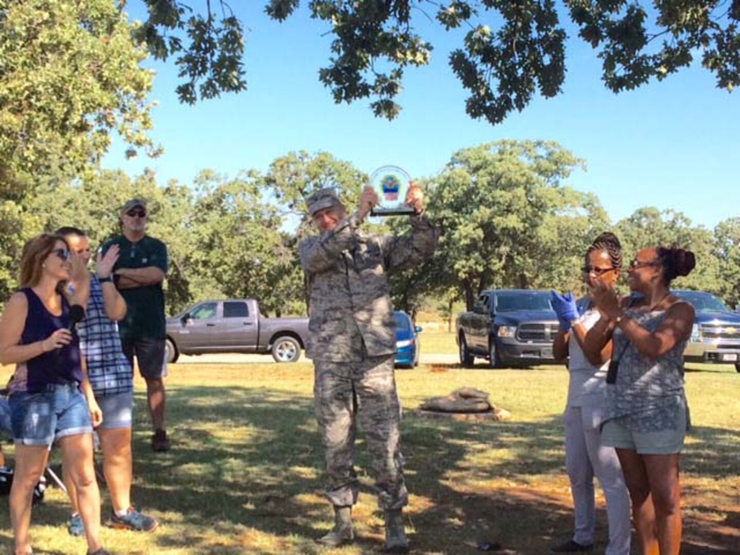 Air Force Col. Ken Ruthardt, Defense Logistics Agency Aviation commander at Oklahoma City, holds up the “DLA Aviation vs. DLA Distribution Food Fight Challenge” trophy in victory Sept. 22, 2016, during a DLA employee appreciation picnic for DLA Employees on Tinker Air Force Base.  The two organizations challenged each other to raise the most food to support the Feds Feed Families program and raised 2,456 pounds of food, which was donated to the Regional Food Bank of Oklahoma.  The organizations plan on making the “Food Fight Challenge” an annual event to support their community. 
