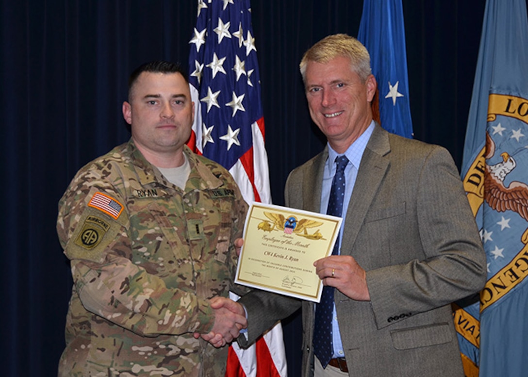 Defense Logistics Agency Aviation’s August 2016 Employee of the Month is Chief Warrant Officer 4 Kevin Ryan, a readiness officer for the Customer Operations Directorate in Richmond, Virginia. DLA Aviation's Chief of Staff Steve Kinskie presents Ryan with the certificate during a ceremony held Oct. 27, 2016 on Defense Supply Center Richmond.