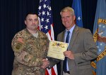Defense Logistics Agency Aviation’s August 2016 Employee of the Month is Chief Warrant Officer 4 Kevin Ryan, a readiness officer for the Customer Operations Directorate in Richmond, Virginia. DLA Aviation's Chief of Staff Steve Kinskie presents Ryan with the certificate during a ceremony held Oct. 27, 2016 on Defense Supply Center Richmond.