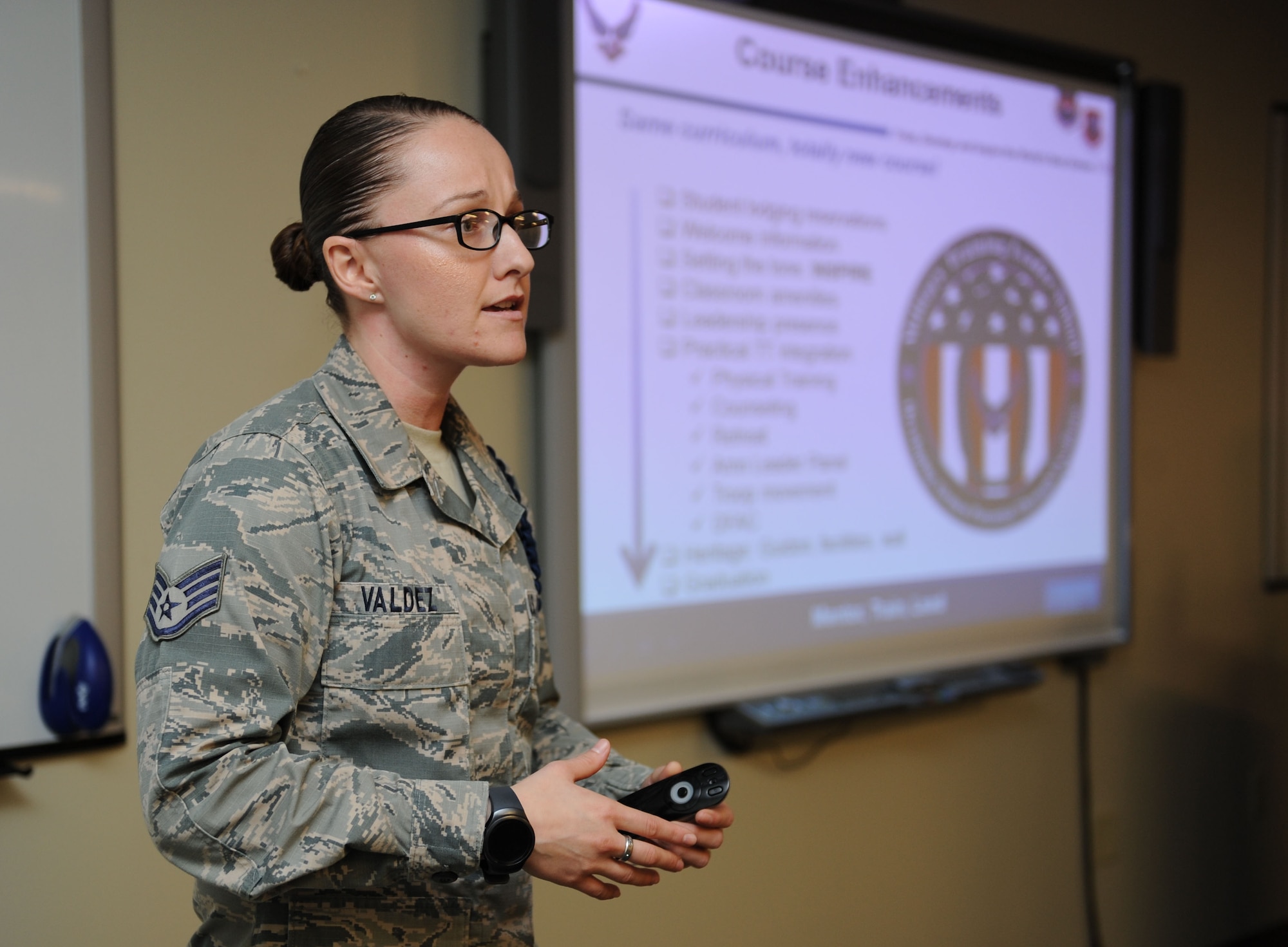 Staff Sgt. Alexandria Valdez, 81st Training Group military training leader course instructor, briefs Chief Master Sgt. Farrell Thomas, 2nd Air Force command chief, on MTL course enhancements during his immersion tour at Allee Hall Feb. 22, 2016, Keesler Air Force Base, Miss. Thomas visited the 81st Training Wing to become oriented with group missions, operations and personnel. (U.S. Air Force photo by Kemberly Groue) 
