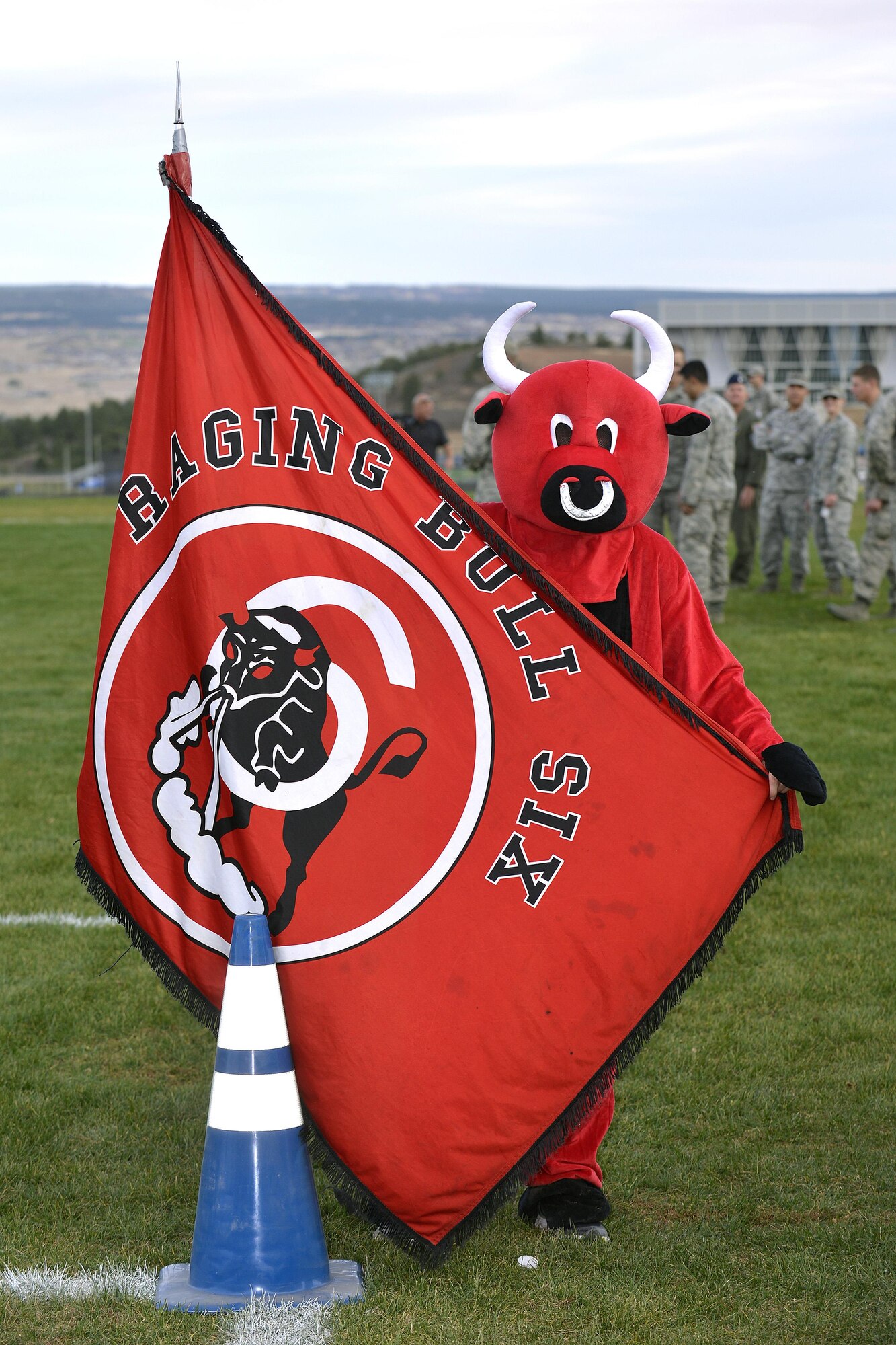 Cadet Squadron 06 mascot, the "Raging Bull," shows off the squadron's flag at the Commandant's Challenge, Oct. 28, 2016, at the Air Force Academy. The challenge is a physically and mentally demanding 48-hour training exercise and contest between the Cadet Wing’s 40 cadet squadrons. Cadet Squadron 06 beat out the competition to take home the Commandant's Challenge trophy. (U.S. Air Force photo/Jason Gutierrez)
