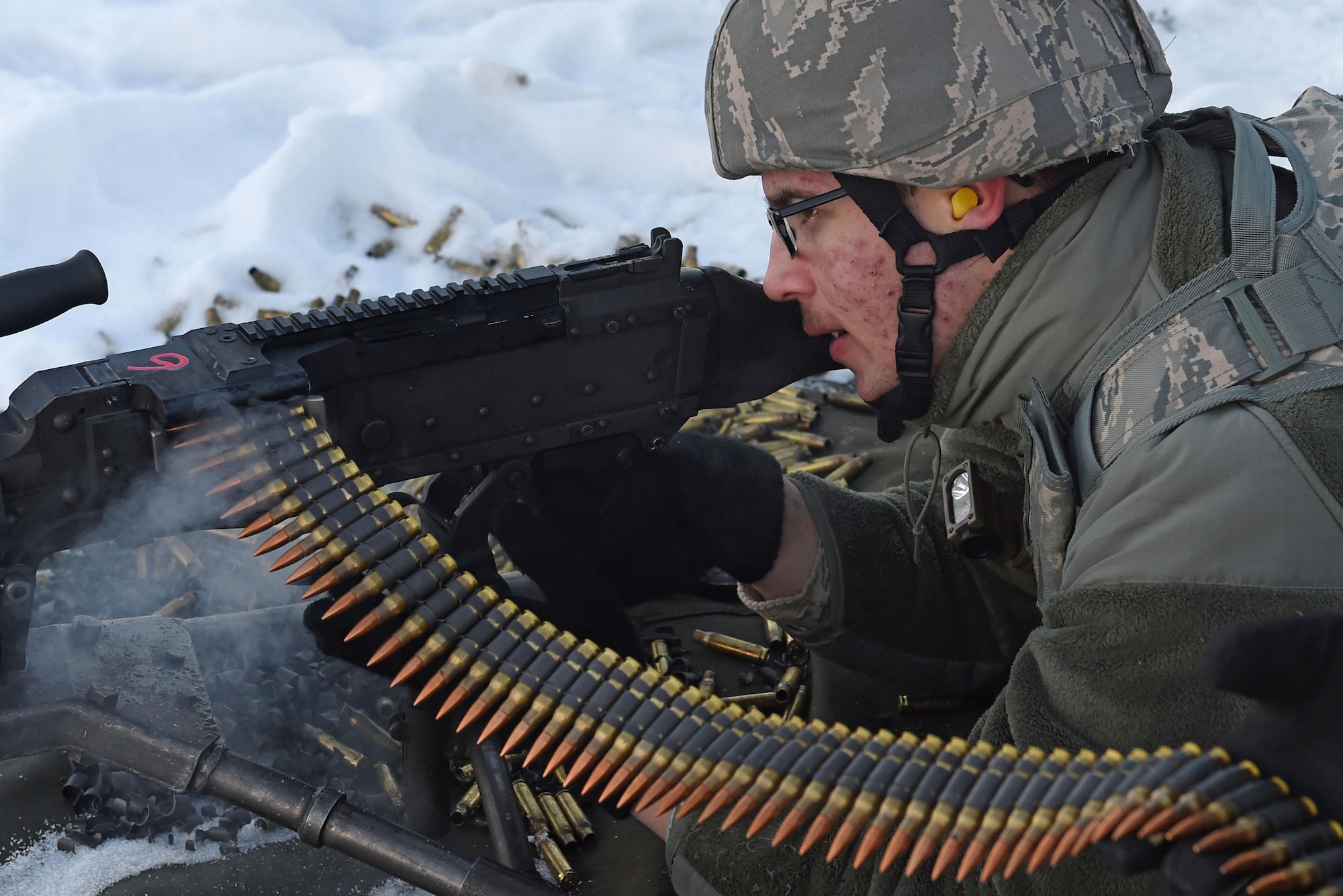 Airman 1st Class Justin Vargas, with the 673d Security Forces Squadron, fires an M240 machine gun during sustainment training on the Grezelka range at Joint Base Elmendorf-Richardson, Alaska, Oct. 27, 2016. Security Forces members regularly train on the use and upkeep of weapons throughout the year. 