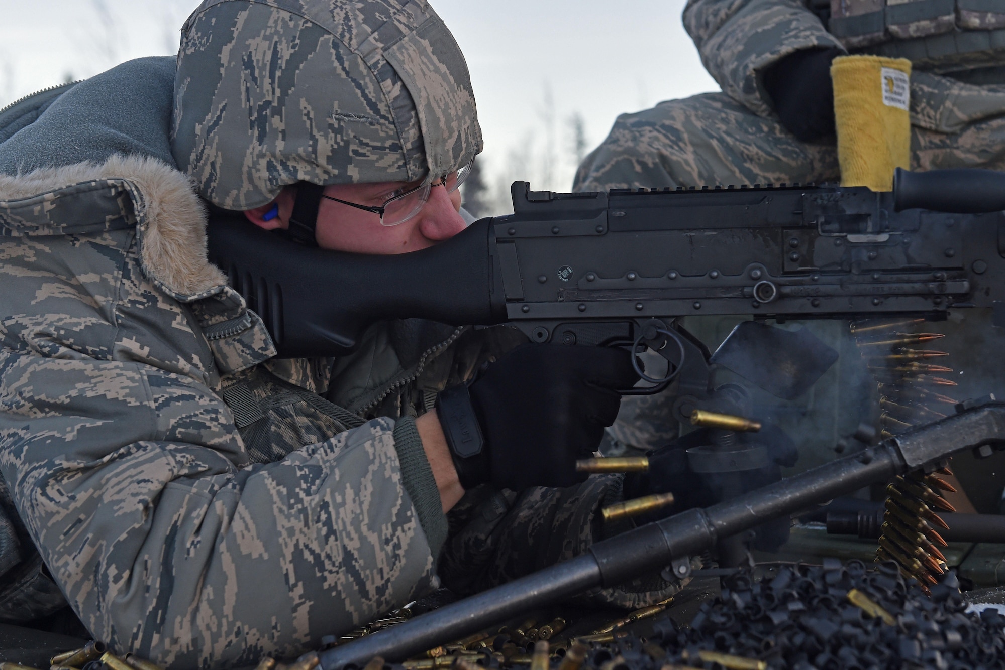 Airman 1st Class Zachary Clifton, with the 673d Security Forces Squadron, fires an M240 machine gun during sustainment training on the Grezelka range at Joint Base Elmendorf-Richardson, Alaska, Oct. 27, 2016. Security Forces members regularly train on the use and upkeep of weapons throughout the year. 