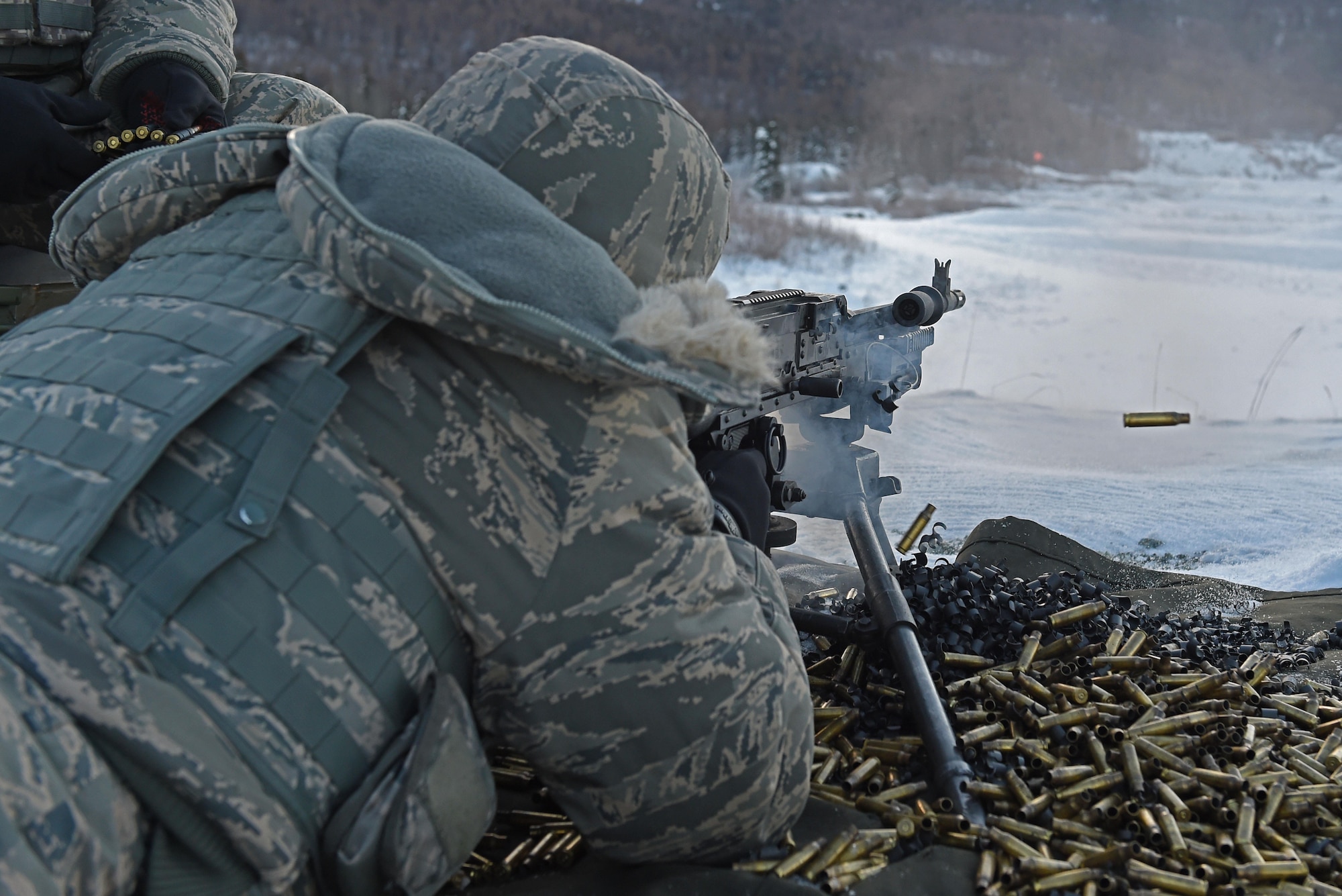 Airman 1st Class Zachary Clifton, with the 673d Security Forces Squadron, fires an M240 machine gun during sustainment training on the Grezelka range at Joint Base Elmendorf-Richardson, Alaska, Oct. 27, 2016. Security Forces members regularly train on the use and upkeep of weapons throughout the year. 