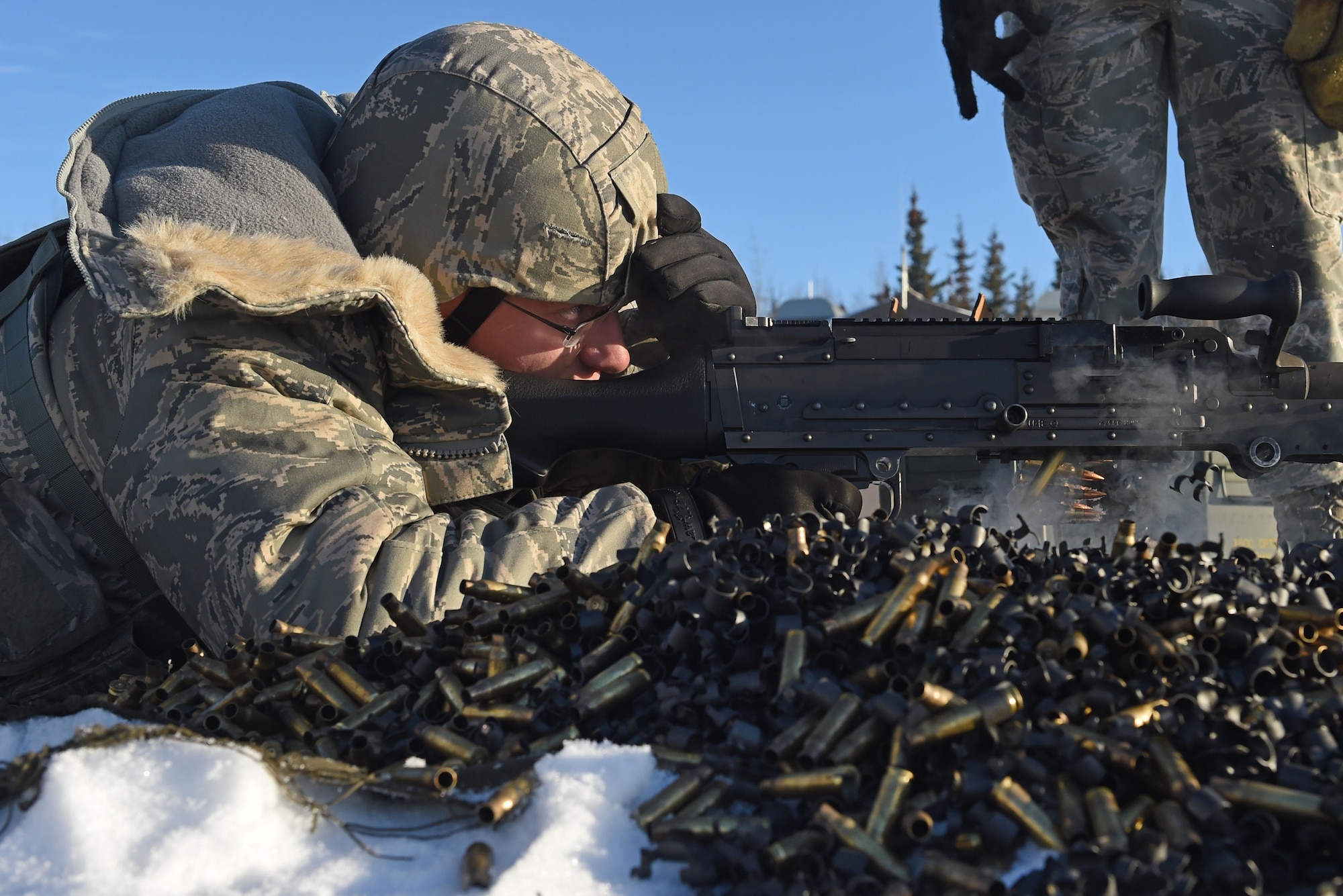 Airman 1st Class Zachary Clifton, with the 673d Security Forces Squadron, fires an M240 machine gun during sustainment training on the Grezelka range at Joint Base Elmendorf-Richardson, Alaska, Oct. 27, 2016. Security Forces members regularly train on the use and upkeep of weapons throughout the year. 