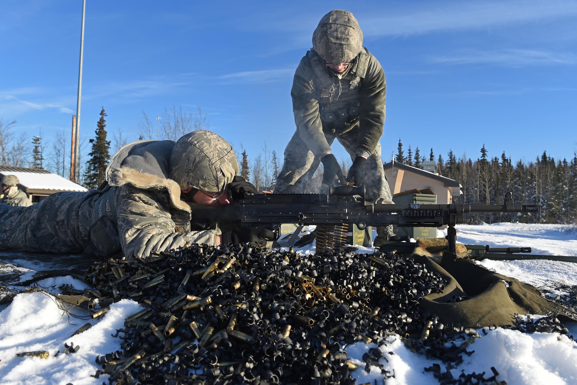 Airman 1st Class Zachary Clifton, with the 673d Security Forces Squadron, fires an M240 machine gun during sustainment training on the Grezelka range at Joint Base Elmendorf-Richardson, Alaska, Oct. 27, 2016. Security Forces members regularly train on the use and upkeep of weapons throughout the year. 