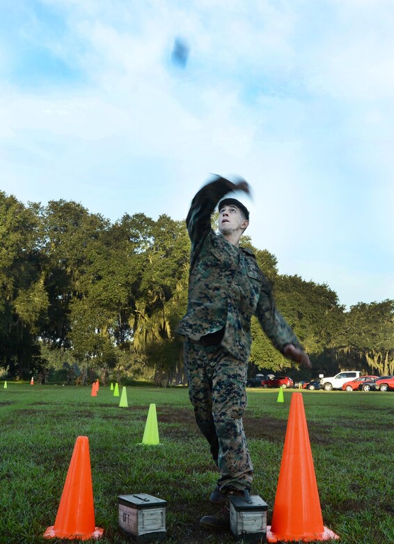 Cpl. Phillip A. Mason, supply administrator, Marine Forces Reserve, throws a simulated grenade during the maneuver-under-fire portion of a recent Combat Fitness Test aboard Marine Corps Logistics Base Albany. 