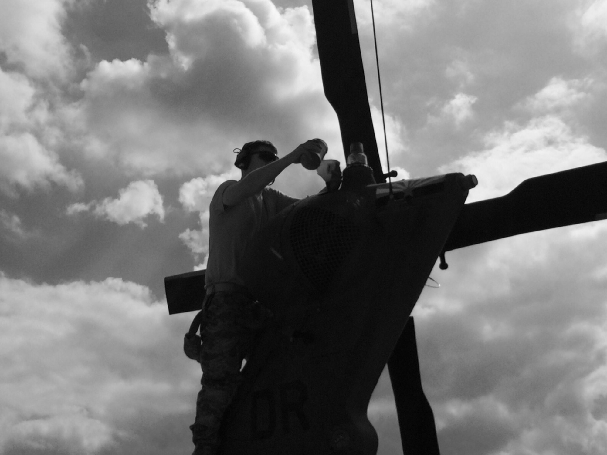 U.S. Air Force Reserve Senior Airman Brandon McLaughlin services a helicopter tail rotor gearbox on an HH-60 PaveHawk helicopter during deployment spinup training at Kadena Air Base, Japan, Oct. 31, 2016.  McLaughlin is assigned to the 943rd Maintenance Squadron, 943rd Rescue Group, Davis-Monthan Air Force Base, Ariz., and is at Kadena AB for Keen Sword, a bilateral defense exercise designed to practice defending Japan against foreign aggression. (Photo by Master Sgt. Greg Gaunt) 
