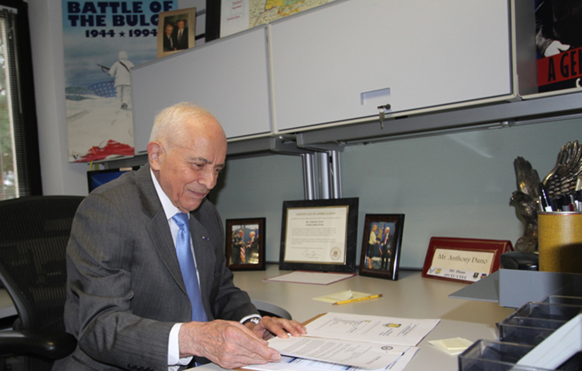 Tony Duno, AFCEC Europe real property expert, looks over paperwork at his desk on Ramstein Air Base, Germany, Oct. 16 -- his last day in the office after more than seven decades of service to our nation. (U.S. Air Force photo/Debbie Aragon)