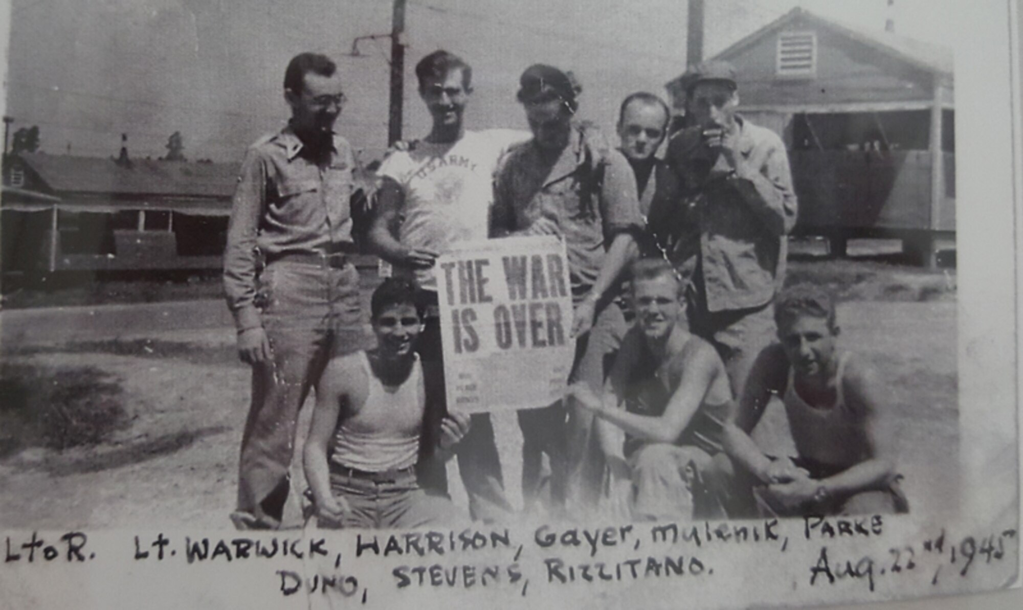 In this 1945 photo, a 20-year-old Tony Duno (bottom left) celebrates the end of World War II following Japan's surrender with fellow soldiers. (Courtesy photo)