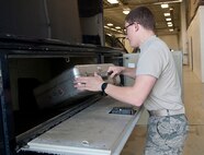 Airman 1st Class Dalton Steele, 91st Missile Maintenance Squadron facilities maintenance technician, removes a pelican case from a truck at Minot Air Force Base, N.D., Oct. 24, 2016. The FMS Airmen check the kits for accountability to ensure all equipment is brought back from missile alert and launch facilities. (U.S. Air Force photo/Airman 1st Class Jonathan McElderry)