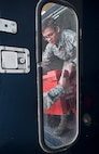 Airman 1st Class Randell Bowen, 91st Missile Maintenance Squadron facilities maintenance technician, hands equipment from a truck at Minot Air Force Base, N.D., Oct. 24, 2016. The FMS Airmen remove missile alert facility and launch facility equipment two to three times a day, a process known as “downloading.” (U.S. Air Force photo/Airman 1st Class Jonathan McElderry)