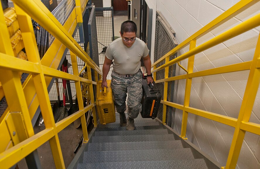 Airman 1st Class Mickel Roe Villar, 91st Missile Maintenance Squadron facilities maintenance technician, carries pelican cases to the equipment storage area at Minot Air Force Base, N.D., Oct. 24, 2016. The FMS Airmen are responsible for dispatching all equipment sent to missile alert and launch facilities. (U.S. Air Force photo/Airman 1st Class Jonathan McElderry)