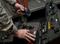 An Airman with the 91st Missile Maintenance Squadron facilities maintenance section scans a personal protective equipment kit at Minot Air Force Base, N.D., Oct. 24, 2016. Once PPE kits are inspected, FMS Airmen scan them back into inventory to help maintain accountability. (U.S. Air Force photo/Airman 1st Class Jonathan McElderry)