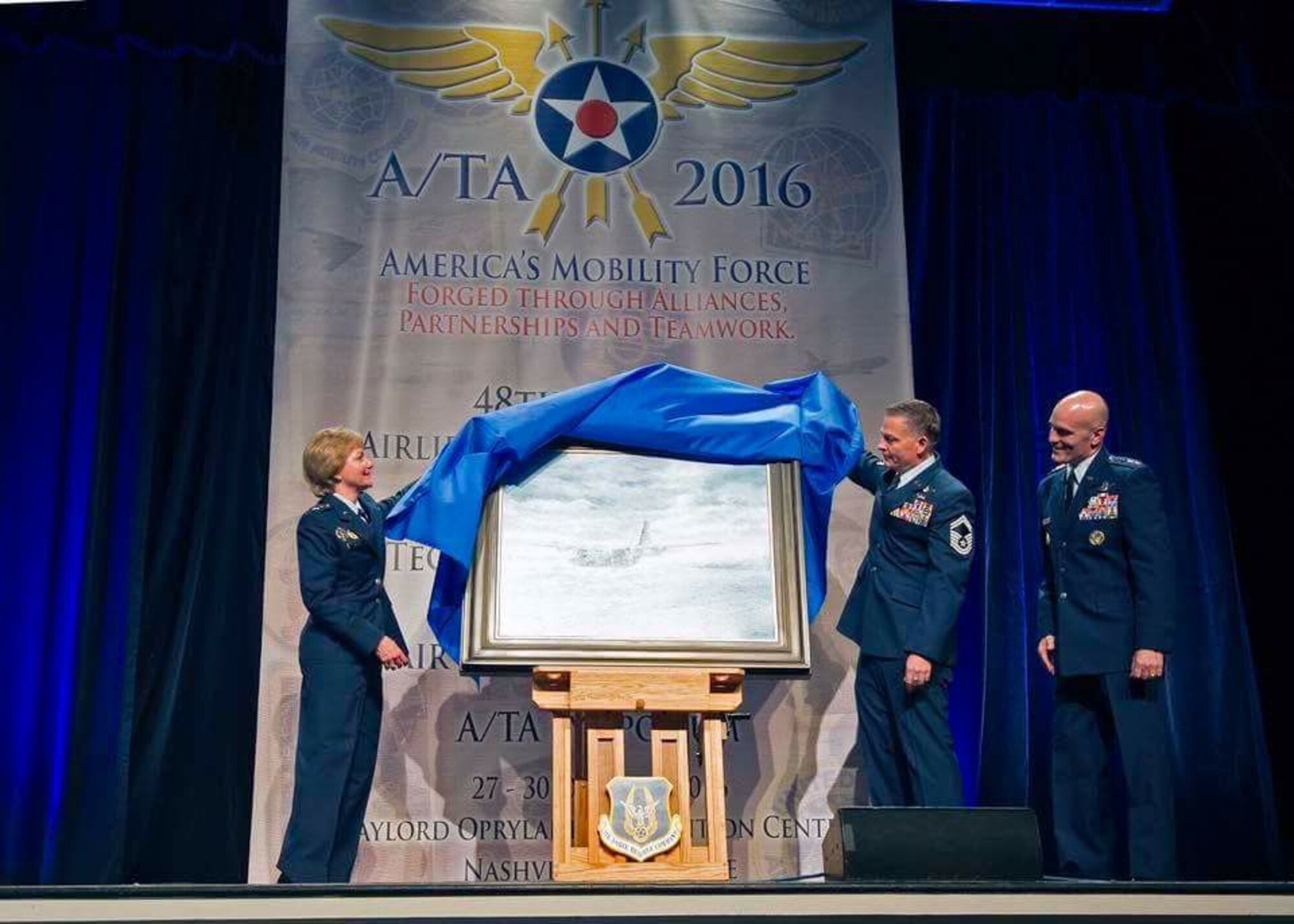 Air Force Reserve Chief, Lt. Gen. Maryanne Miller, Senior Master Sgt. Darby Perrin, 465th Air Refueling Squadron and Commander Air Mobility Command Gen. Carlton D. Everhart III unveil the painting “Deepwater Horizon” at the 2016 Airlift/Tanker Association and Air Mobility Command Symposium in Nashville, Tennessee. The painting, created by Perrin, is the newest addition to the Air Force Art Program and commemorates the cleanup efforts 910th Airlift Wing’s citizen airmen assisted with during the 2010 BP Deepwater Horizon oil spill. 