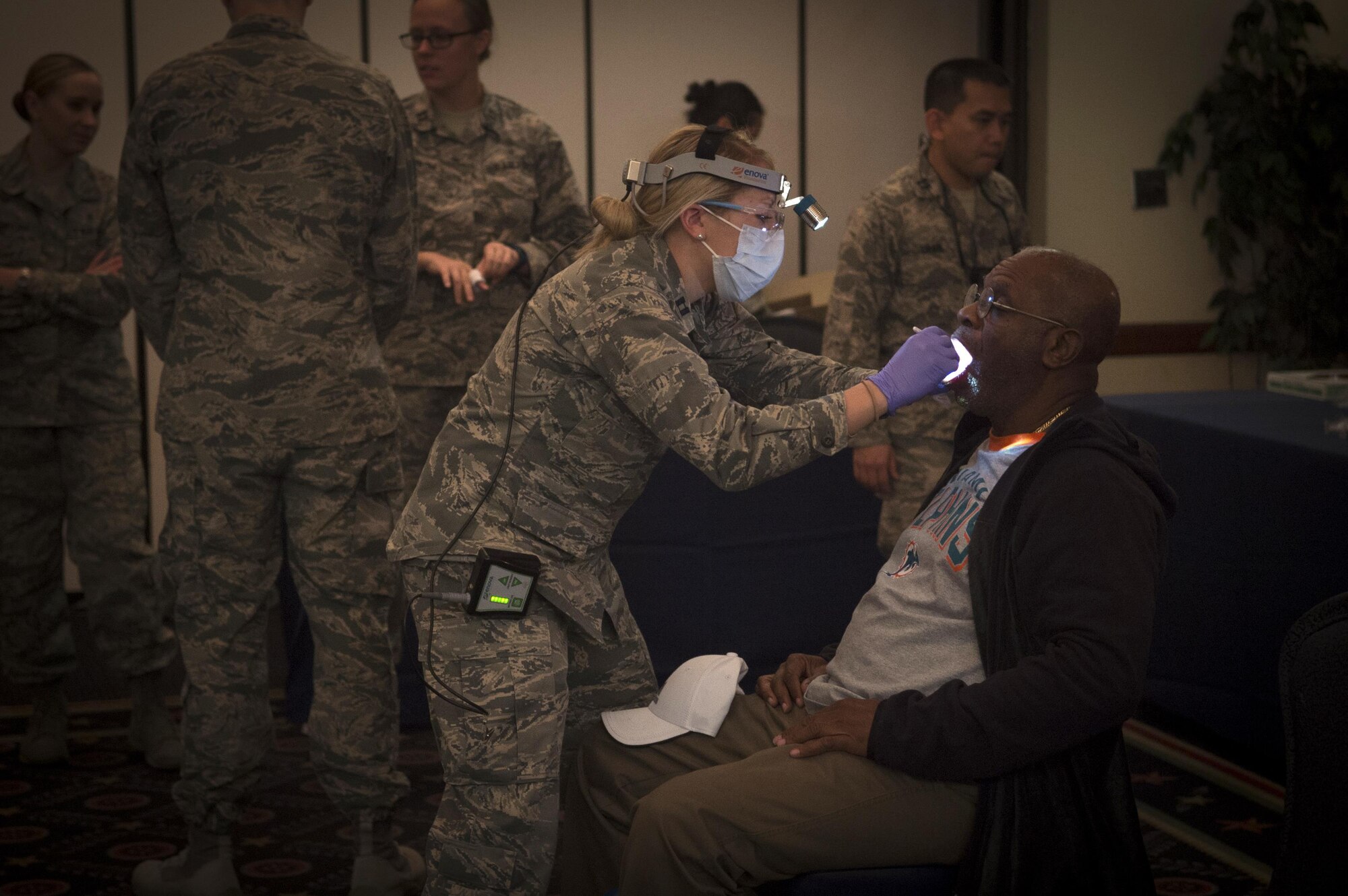 Anthony Floyd, Air Force retiree, has his teeth examined during Retiree Appreciation Day on Joint Base Andrews, Md., Oct. 29, 2016. The event included a health fair and flu shots, and also gave information on Tricare, recreation activities, and more. (U.S. Air Force photo by Senior Airman Mariah Haddenham)