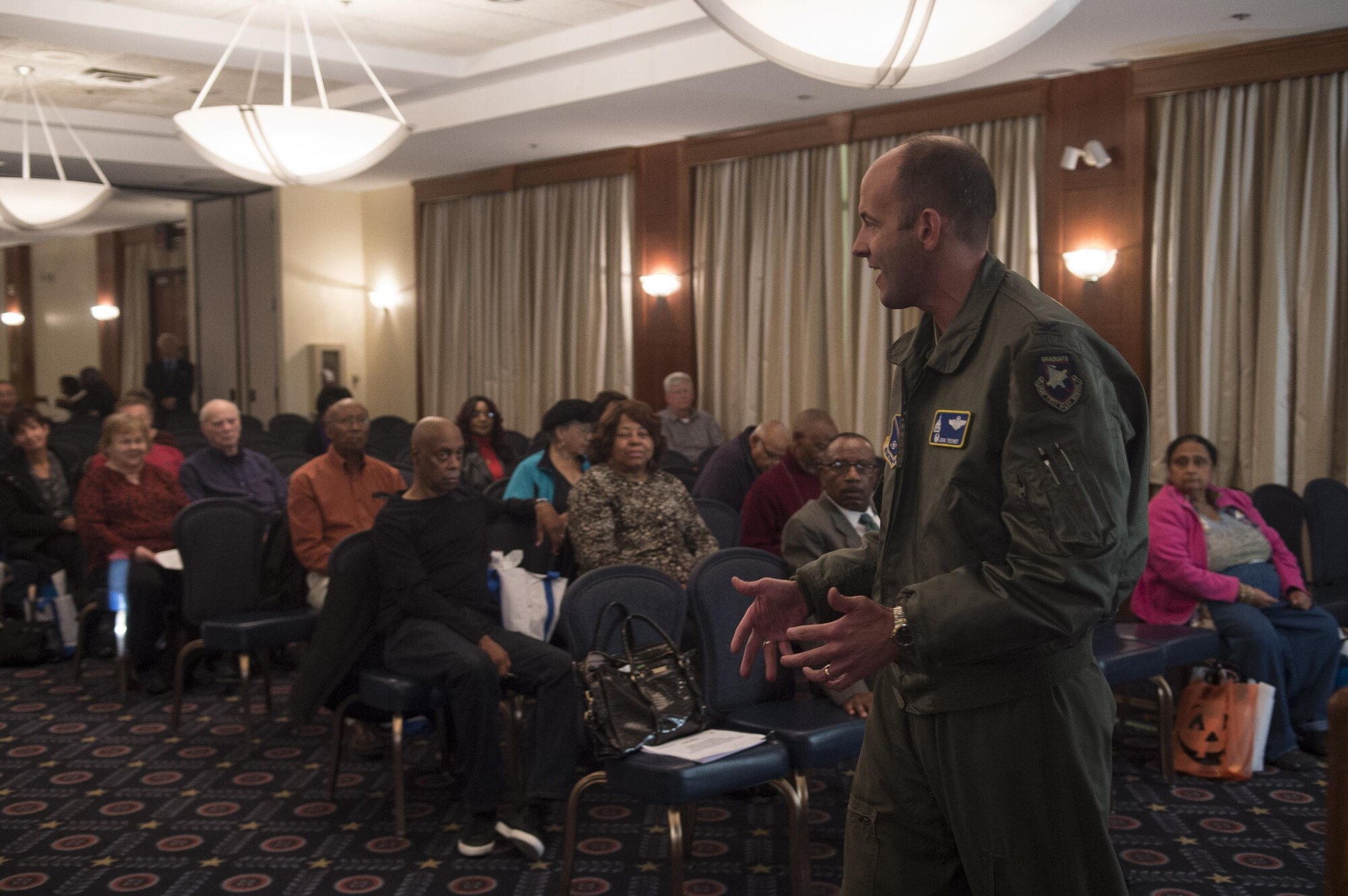 Col. E. John Teichert, 11th Wing and JBA commander, speaks at Retiree Appreciation Day on Joint Base Andrews, Md., Oct. 29, 2016. The event included a health fair and flu shots, and also gave information on Tricare, recreation activities, and more. (U.S. Air Force photo by Senior Airman Mariah Haddenham)