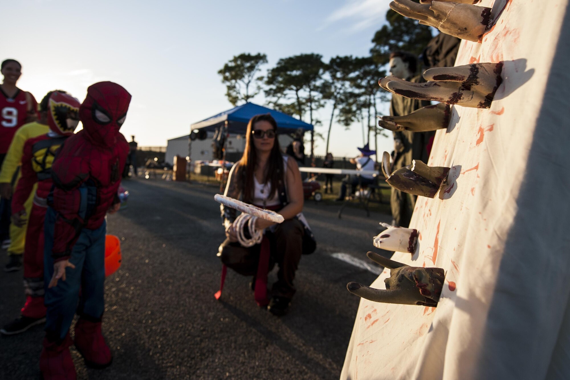 A child plays a ring toss game during the Haunted Lakes Fall Festival at Gator Lakes Golf Course on Hurlburt Field, Fla., Oct. 28, 2016. The festival was a free event hosted by the 1st Special Operations Force Support Squadron with complimentary food and fun for kids of all ages that included haunted hay rides, costume contests, games and a movie. (U.S. Air Force photo by Airman 1st Class Joseph Pick)