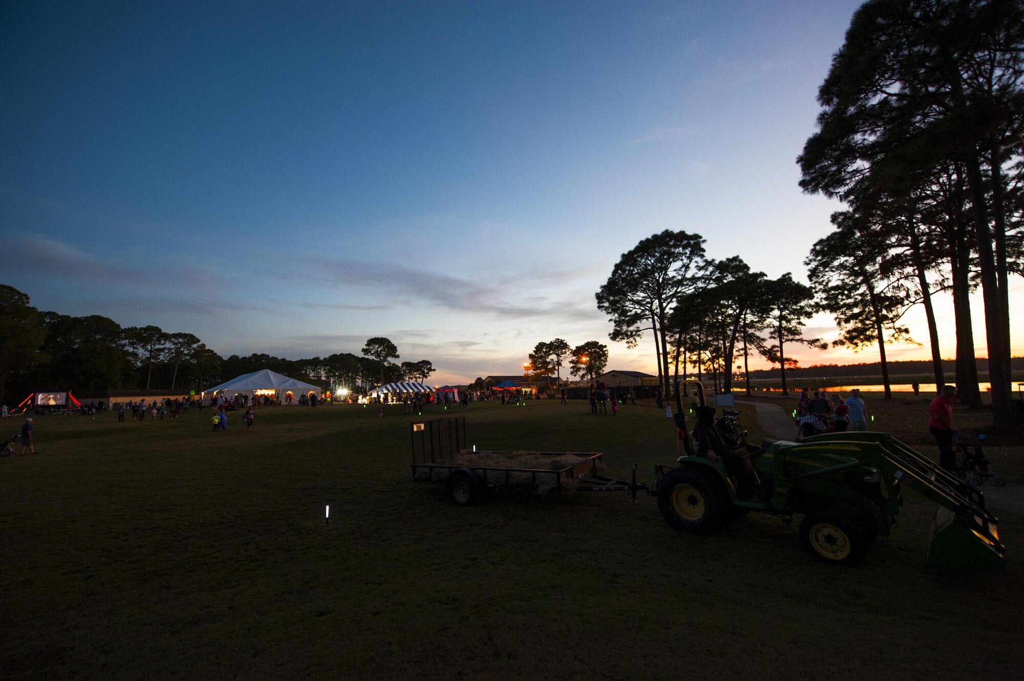 The sun sets during the Haunted Lakes Fall Festival at Gator Lakes Golf Course on Hurlburt Field, Fla., Oct. 28, 2016.  The festival was a free event hosted by the 1st Special Operations Force Support Squadron with complimentary food and fun for kids of all ages that included haunted hay rides, costume contests, games and a movie. (U.S. Air Force photo by Airman 1st Class Joseph Pick)