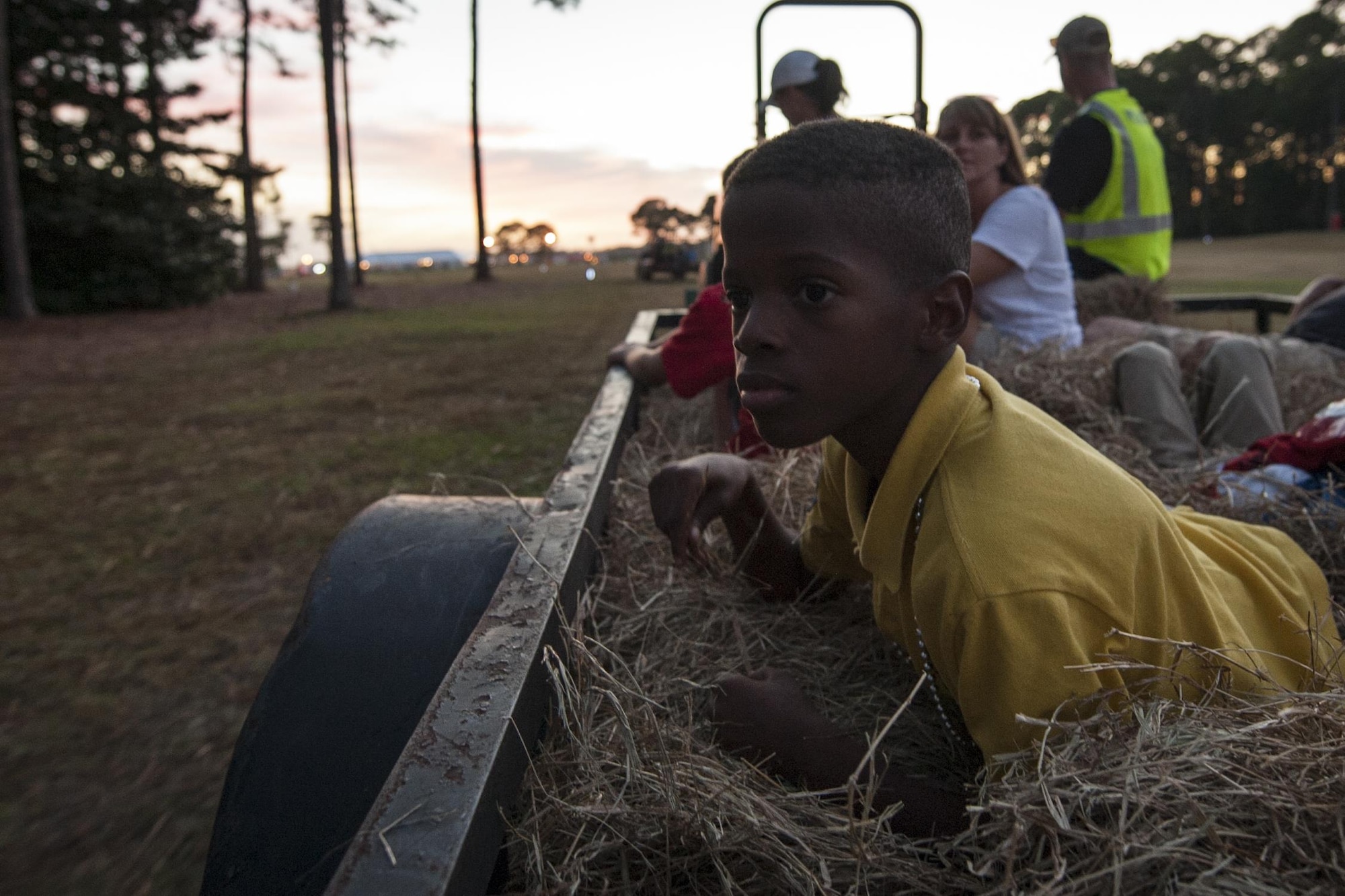 A child rides on a wagon during the haunted hay ride during the Haunted Lakes Fall Festival at Gator Lakes Golf Course on Hurlburt Field, Fla., Oct. 28, 2016. The hay ride took participants through a series of spooky displays. (U.S. Air Force photo by Airman 1st Class Joseph Pick)