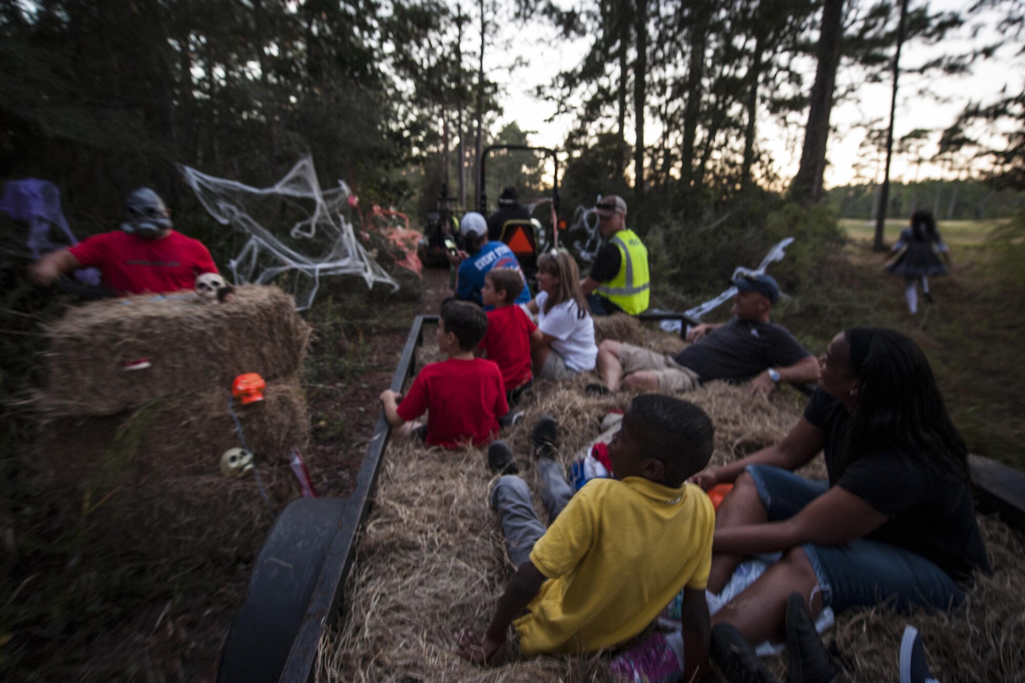 Air Commandos and their families ride the haunted hay ride during the Haunted Lakes Fall Festival at Hurlburt Field, Fla., Oct. 28, 2016. The hay ride took participants through a series of spooky displays. (U.S. Air Force photo by Airman 1st Class Joseph Pick)