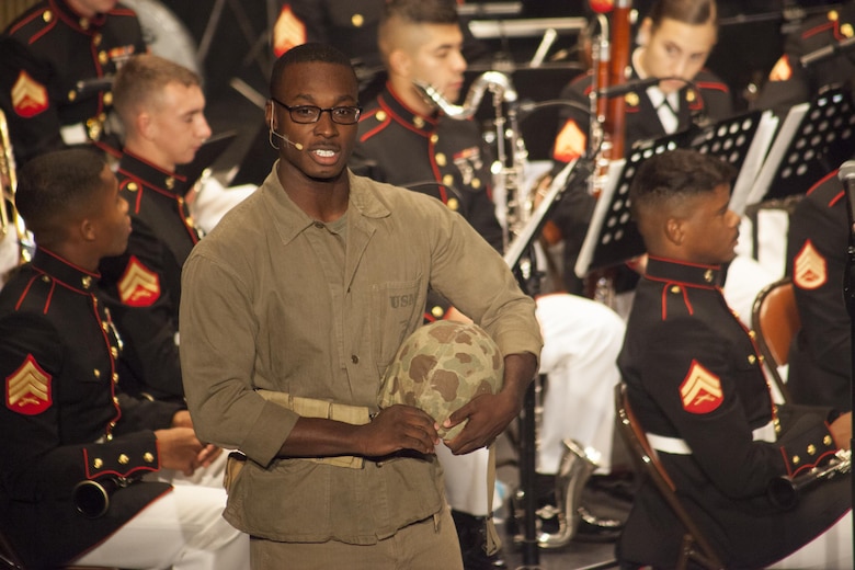 Corporal Quami N. Dixon, an actor with Marine Corps Band New Orleans, highlights the history of African Americans in the Marine Corps Reserve at the Ponce La Perla Theater during a concert to celebrate the Marine Corps Reserve Centennial in Puerto Rico on Oct. 17, 2016. Marine Forces Reserve is commemorating 100 years of rich history, heritage, espirit-de-corps across the U.S. The Centennial celebration recognizes the Reserve's essential role as a crisis response force and expeditionary force in readiness, constantly preparing to augment the active component. (U.S. Marine photo by LCpl. Ricardo Davila/ Released)