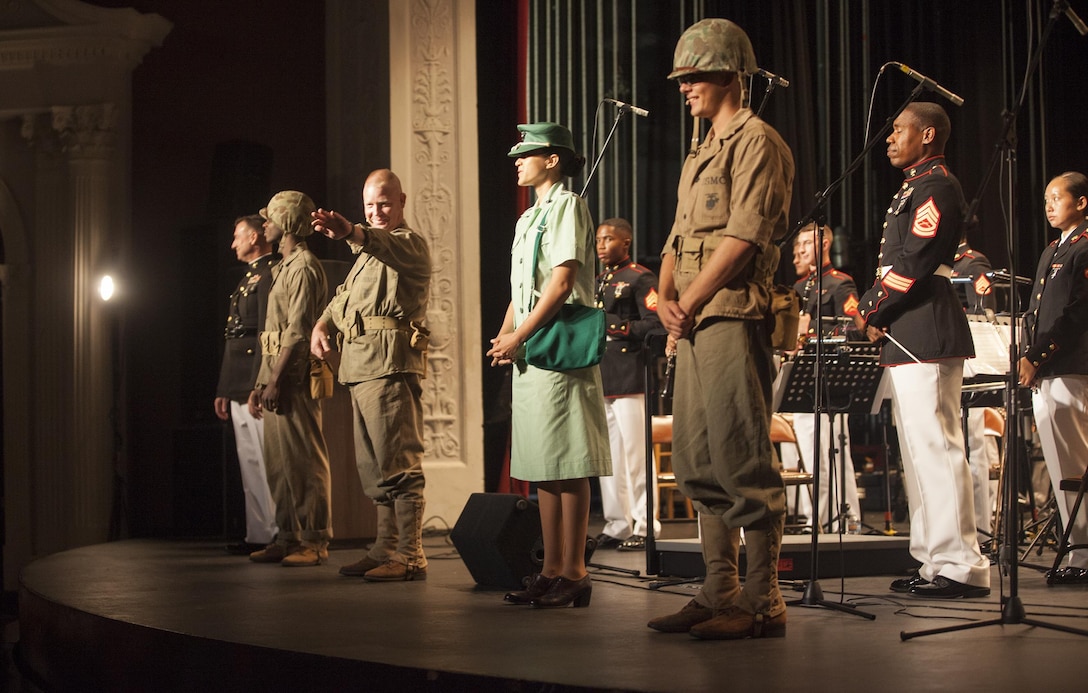 Actors with Marine Corps Band New Orleans, wear period piece costumes to represent important historical points in Marine Corps Reserve history at the Ponce La Perla Theater during a concert to celebrate the Marine Corps Reserve Centennial in Puerto Rico on Oct. 17, 2016. Marine Forces Reserve is commemorating 100 years of rich history, heritage, espirit-de-corps across the U.S. The Centennial celebration recognizes the Reserve's essential role as a crisis response force and expeditionary force in readiness, constantly preparing to augment the active component. (U.S. Marine photo by LCpl. Ricardo Davila/ Released)