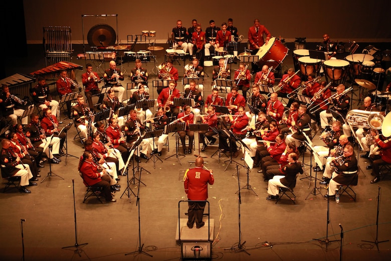 Marine Corps Band New Orleans, the Municipal Band of Humacao, and Puerto Rican Salsadero,Jerry Rivas, from El Gran Combo perform for the local residents and distinguished guest during the Marine Forces Reserve Centennial Celebration concert at the Centro De Bellas Artes in Humacao, Puerto Rico, Oct. 19, 2016. Marine Forces Reserve is commemorating 100 years of rich history, heritage, Espirit-de-corps across the U.S. This celebration recognizes the Reserve's essential role as a crisis response force and expeditionary force in readiness, constantly preparing to augment the active component. (U.S. Marine photo by Master Sgt. John A. Lee, II / Released)