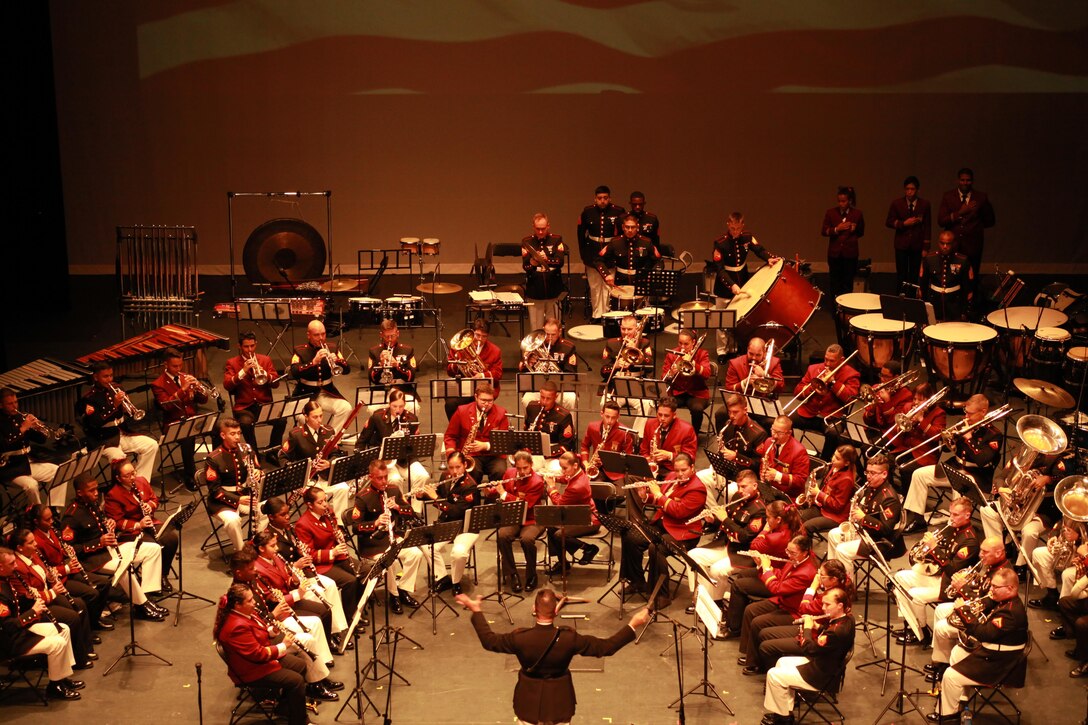 Marine Corps Band New Orleans and the Municipal Band of Humacao perform for the local residents and distinguished guest during the Marine Forces Reserve Centennial Celebration concert at the Centro De Bellas Artes in Humacao, Puerto Rico, Oct. 19, 2016. Marine Forces Reserve is commemorating 100 years of rich history, heritage, Espirit-de-corps across the U.S. This celebration recognizes the Reserve's essential role as a crisis response force and expeditionary force in readiness, constantly preparing to augment the active component. (U.S. Marine photo by Master Sgt. John A. Lee, II / Released)