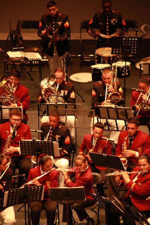 Marine Corps Band New Orleans and the Municipal Band of Humacao perform for the local residents and distinguished guest during the Marine Forces Reserve Centennial Celebration concert at the Centro De Bellas Artes in Humacao, Puerto Rico, Oct. 19, 2016. Marine Forces Reserve is commemorating 100 years of rich history, heritage, Espirit-de-corps across the U.S. This celebration recognizes the Reserve's essential role as a crisis response force and expeditionary force in readiness, constantly preparing to augment the active component. (U.S. Marine photo by Master Sgt. John A. Lee, II / Released)