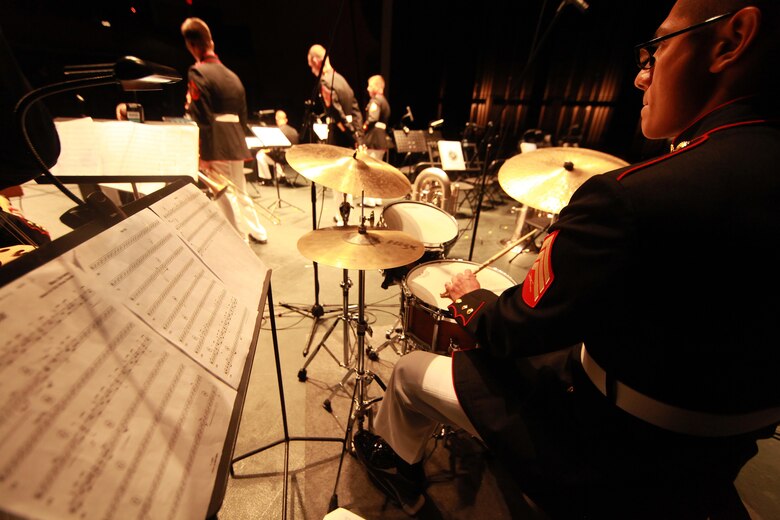 Sergeant Estuardo Espinosa from Marine Corps Band New Orleans plays the drums during a latin performance for the local residents and distinguished guest during the Marine Forces Reserve Centennial Celebration concert at the Centro De Bellas Artes in Humacao, Puerto Rico, Oct. 19, 2016. Marine Forces Reserve is commemorating 100 years of rich history, heritage, Espirit-de-corps across the U.S. This celebration recognizes the Reserve's essential role as a crisis response force and expeditionary force in readiness, constantly preparing to augment the active component. (U.S. Marine photo by Master Sgt. John A. Lee, II / Released)