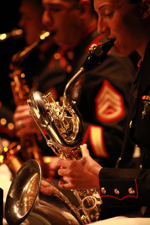 Corporal Julia Buzak from Marine Corps Band New Orleans plays her instrument with fellow member of the Jazz Ensemble during a latin performance for the local residents and distinguished guest during the Marine Forces Reserve Centennial Celebration concert at the Centro De Bellas Artes in Humacao, Puerto Rico, Oct. 19, 2016. Marine Forces Reserve is commemorating 100 years of rich history, heritage, Espirit-de-corps across the U.S. This celebration recognizes the Reserve's essential role as a crisis response force and expeditionary force in readiness, constantly preparing to augment the active component. (U.S. Marine photo by Master Sgt. John A. Lee, II / Released)
