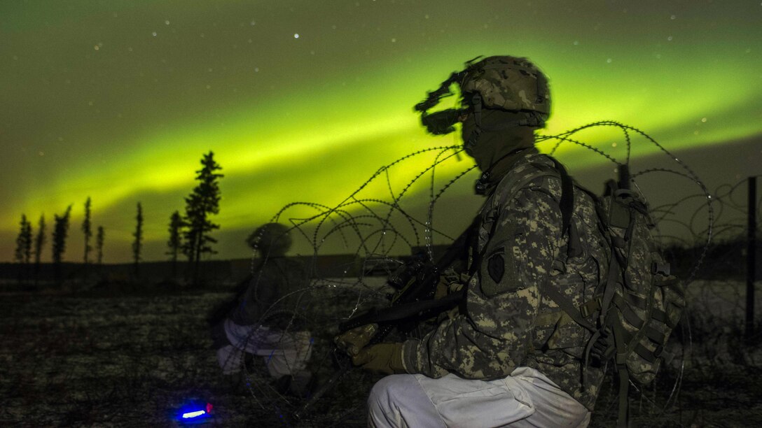 <strong>Photo of the Day: Nov. 1, 2016</strong><br/><br />Soldiers secure an area in view of the aurora borealis during night live-fire training as part of Exercise Spartan Cerberus at Fort Greely, Alaska, Oct. 25, 2016.  Army photo by Staff Sgt. Daniel Love<br/><br /><a href="http://www.defense.gov/Media/Photo-Gallery?igcategory=Photo%20of%20the%20Day"> Click here to see more Photos of the Day. </a> 