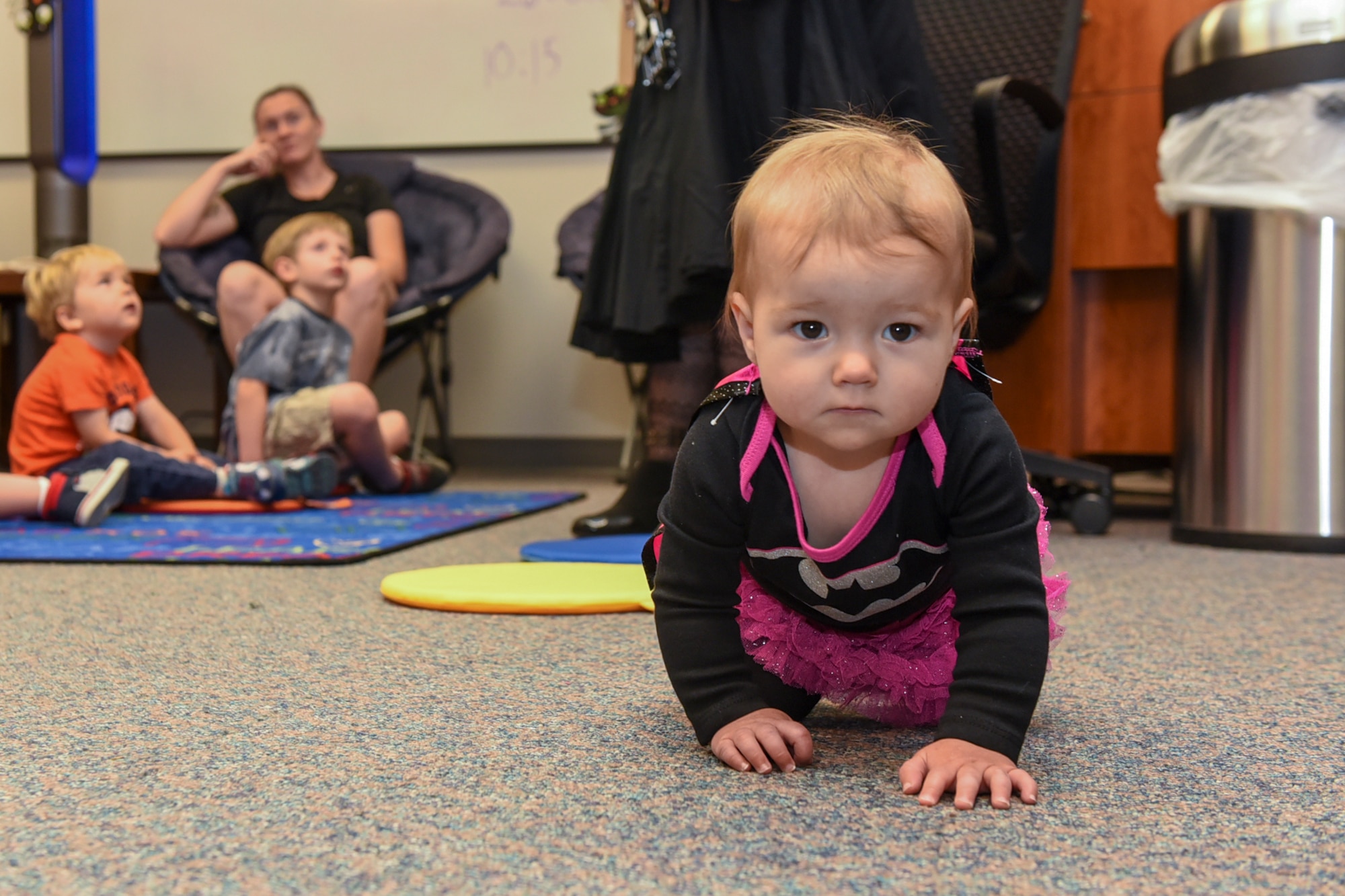 PETERSON AIR FORCE BASE, Colo. – Emma Christensen checks out what’s going on at Halloween Storytime held at the base library on Peterson Air Force Base, Colo., Oct. 26, 2016.  Around 25 children and their parents listened to Halloween stories, created crafts, and enjoyed candies and snacks. (U.S. Air Force photo by Philip Carter)
