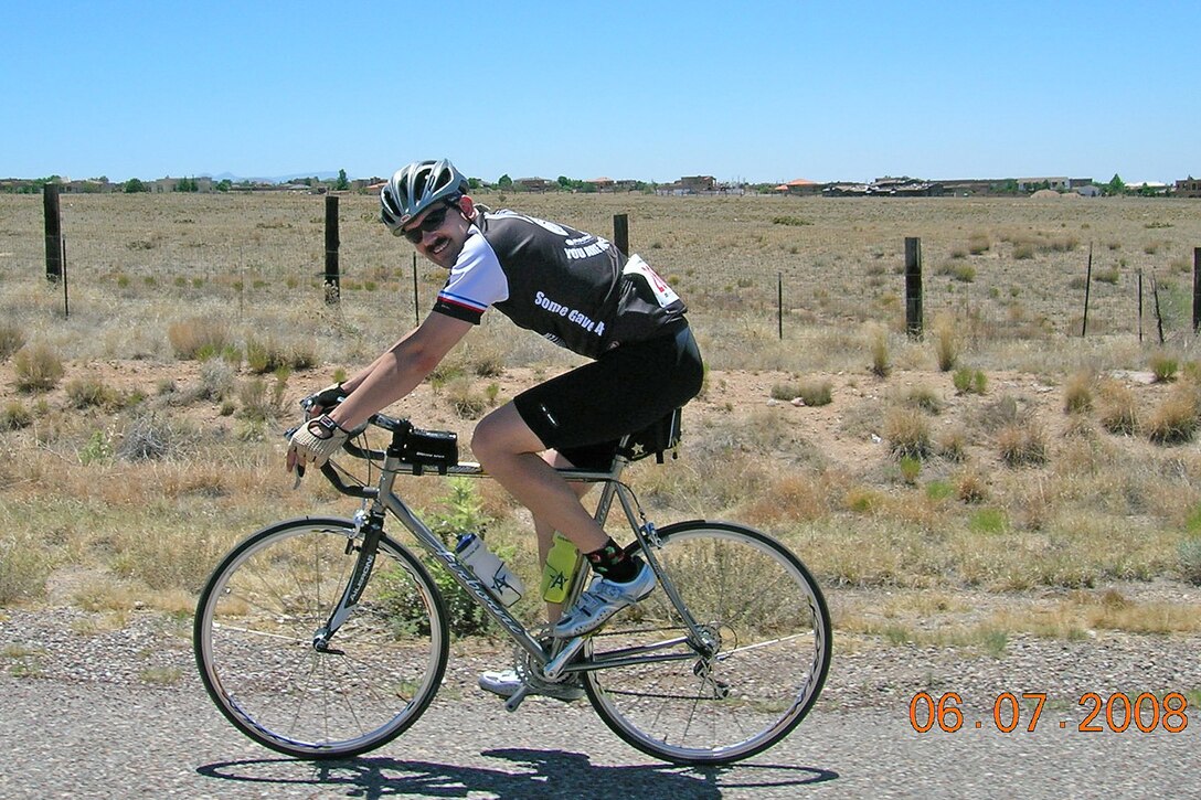 Then Maj. Craig Forcum, now 341st Medical Group commander, rides his bicycle during a 100-mile ride June 2008, in Albuquerque, New Mexico. Forcum is an avid bicyclist and likes to ride his bike to work as much as possible. (Courtesy photo)