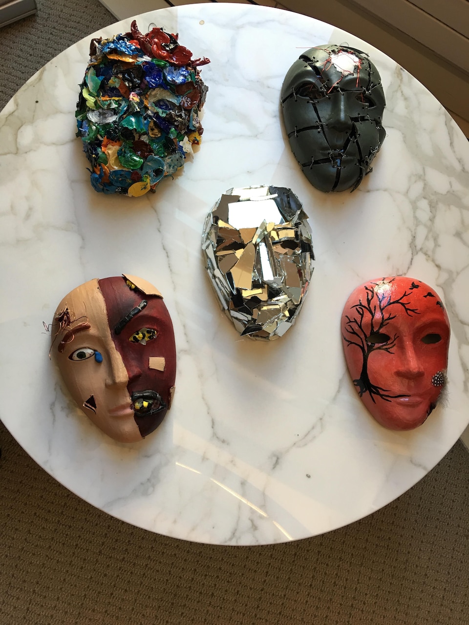 Masks, decorated by service members, sit on display as part of the Creative Forces: NEA Military Healing Arts Network at the National Intrepid Center of Excellence in Bethesda, Md.,  Oct. 21, 2016. National Endowment for the Arts courtesy photo