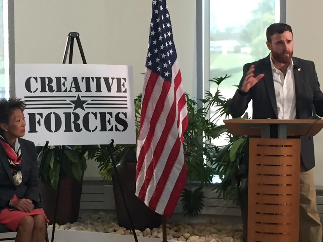 Rusty Noesner, a retired Navy Seal Team 10 member who served in Kandahar, Afghanistan, in 2010, shares his experience about therapeutic creative arts therapies in remarks at the National Intrepid Center of Excellence in Bethesda, Md., Oct. 21, 2016. Noesner suffered traumatic brain injury following a rocket attack. DoD  photo by Amaani Lyle