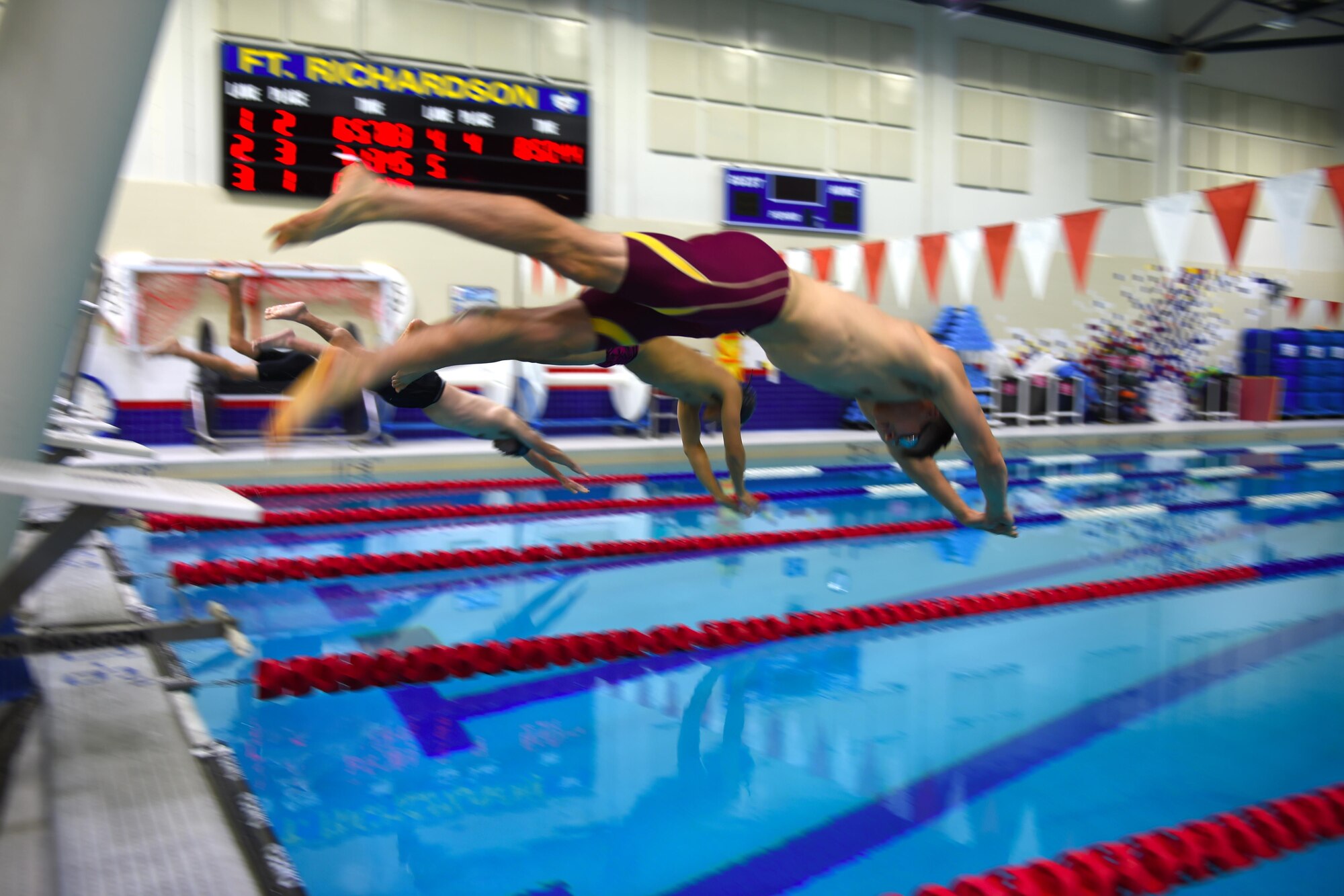 Joint Base Elmendorf-Richardson athletes dive into the pool at Buckner Physical Fitness Center, Oct. 28, 2016. Thirty people participated in 28 events during the final swim meet of the year. Scores from both meets were combined to determine first, second and third place winners. 