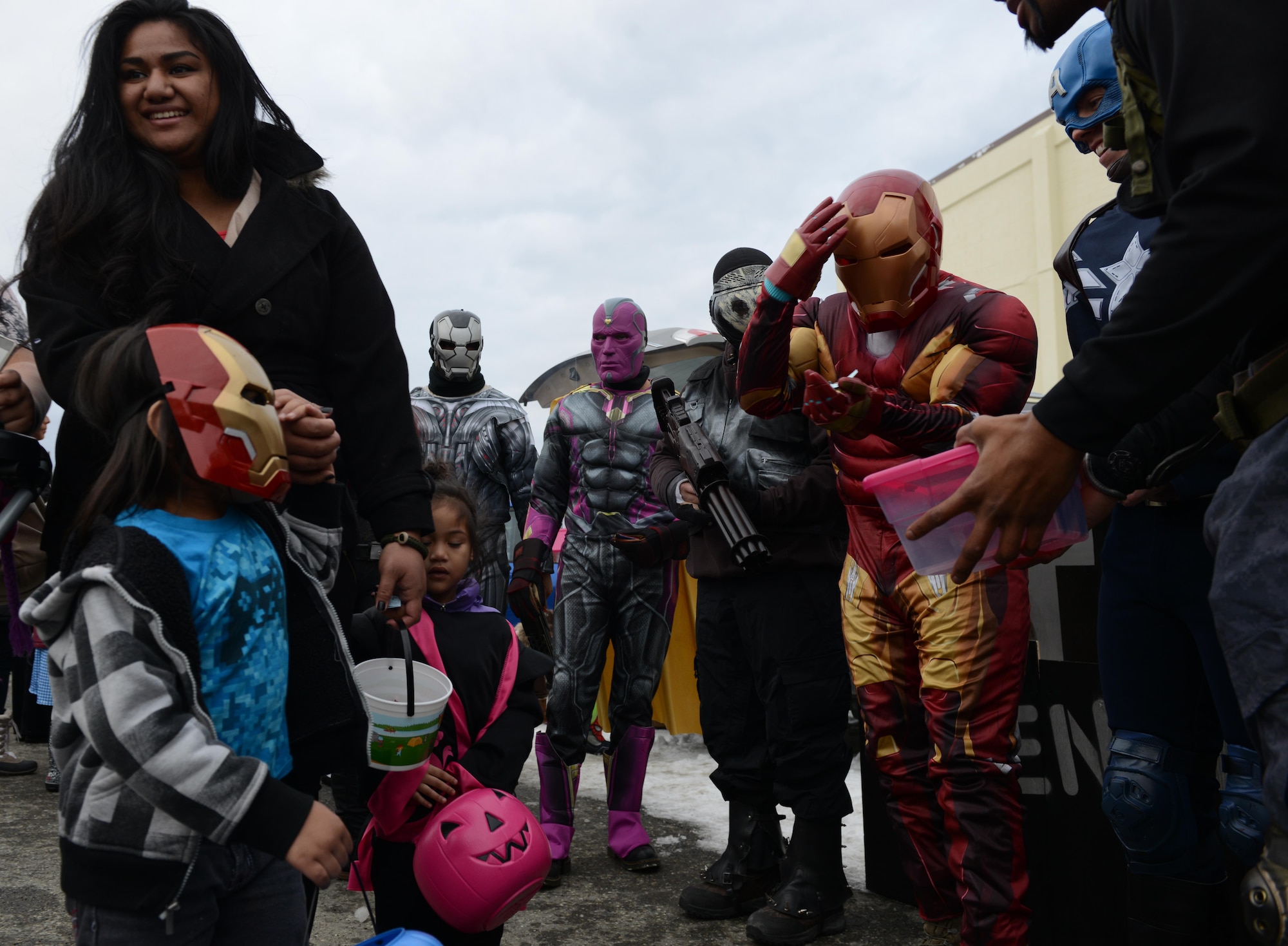 Joint Base Elmendorf-Richardson superheroes trick-or-treat during Trunk or Treat at the Arctic Oasis Oct. 28, 2016. JBER Halloween aficionados decorated their vehicles and handed out candy during Trunk or Treat as attendees voted on the best-decorated trunk. Trick-or-treaters also participated in indoor Halloween games and activities.