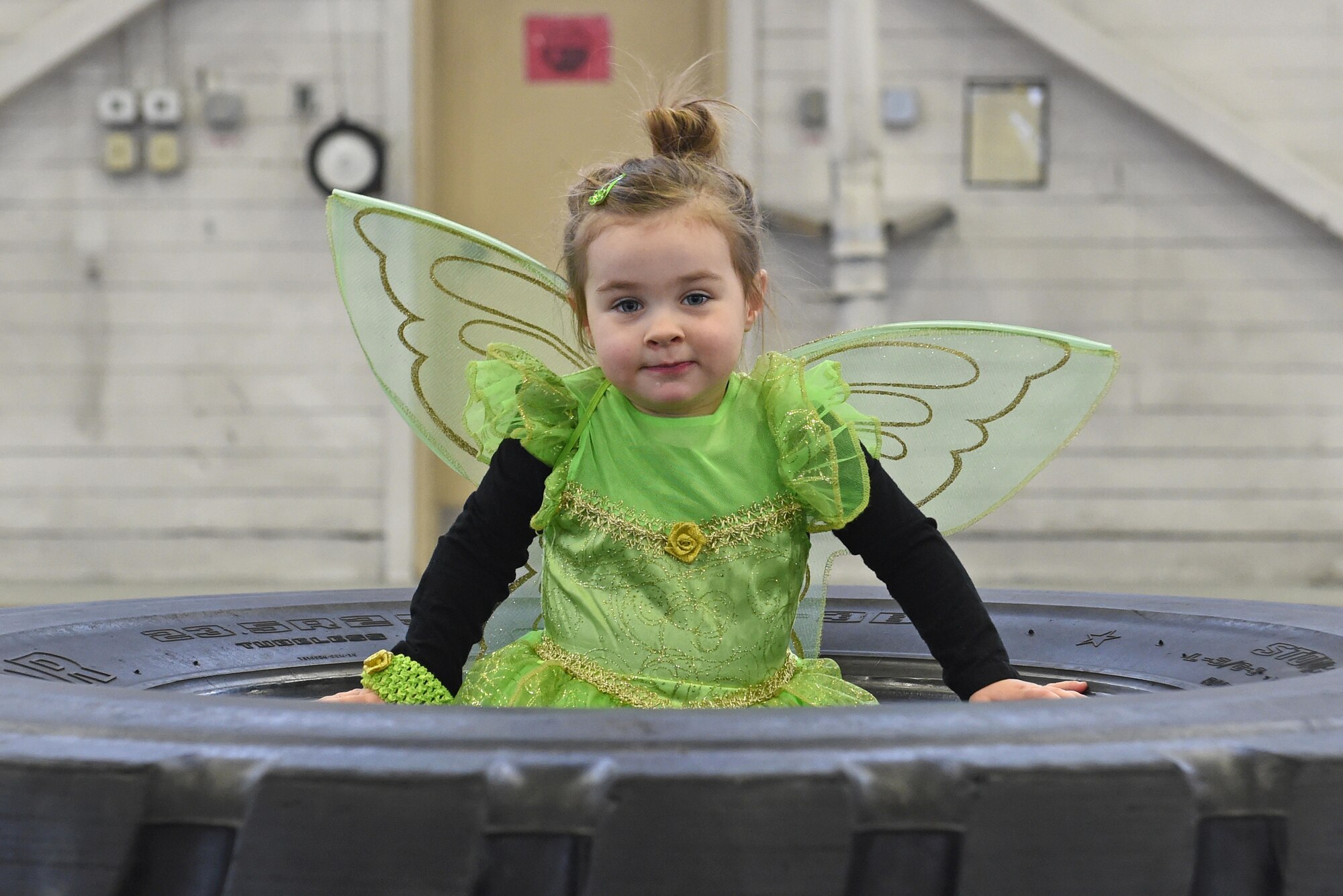Quinn Conger, 3, takes a break before the start of a costume fun run in Hangar 5 at Joint Base Elmendorf-Richardson, Alaska, Oct. 28, 2016. The run was a mile long and prizes were awarded to the top three finishers as well as best adult and child costumes. 