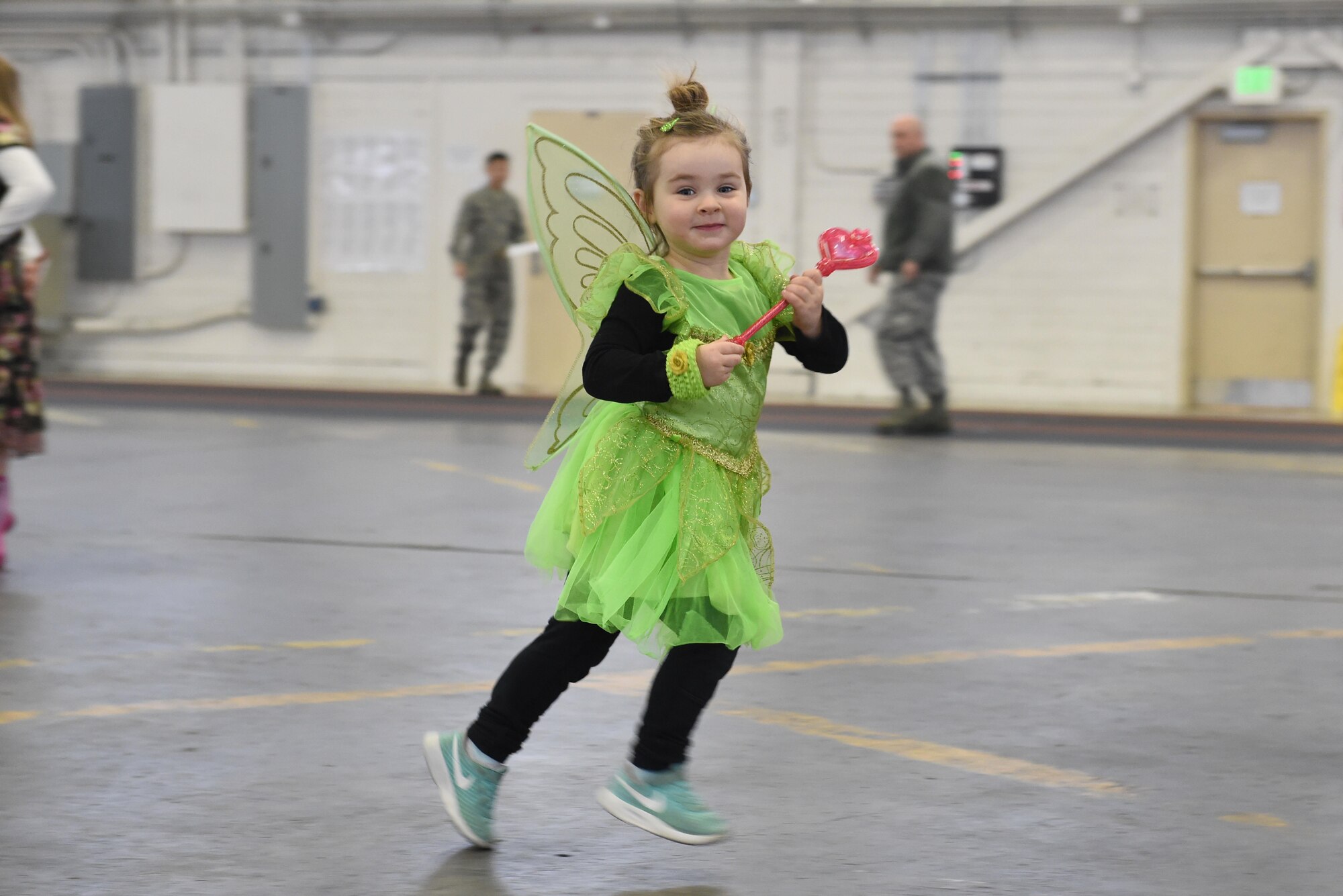 Quinn Conger, 3, warms up before the start of a costume fun run in Hangar 5 at Joint Base Elmendorf-Richardson, Alaska, Oct. 28, 2016. The run was a mile long and prizes were awarded to the top three finishers as well as best adult and child costumes. 