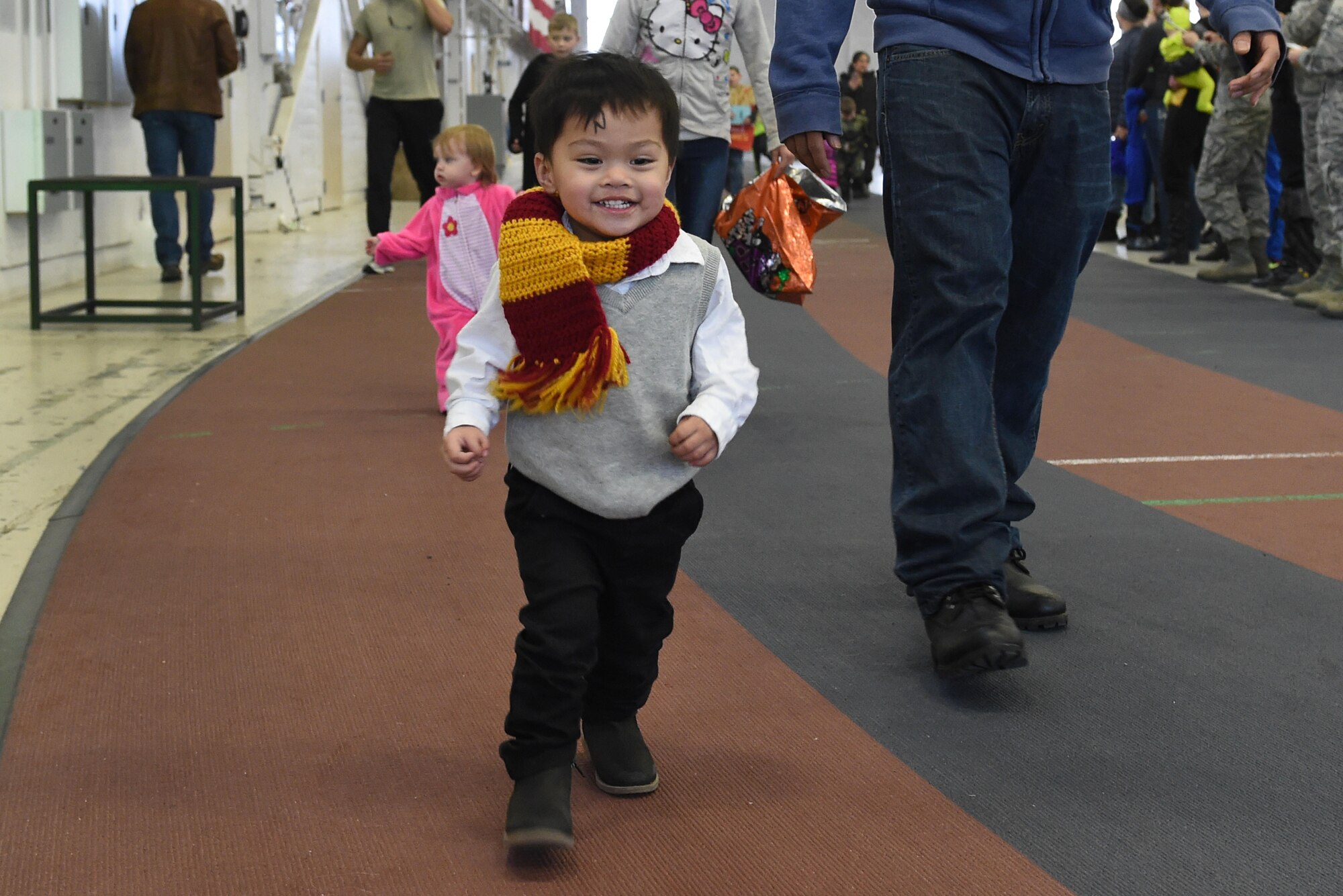 Aiden Manera, 2, participates in a costume fun run in Hangar 5 at Joint Base Elmendorf-Richardson, Alaska, Oct. 28, 2016. The run was a mile long and prizes were awarded to the top three finishers as well as best adult and child costumes. (U.S. Air Force photo by Airman 1st Class Valerie Monroy)