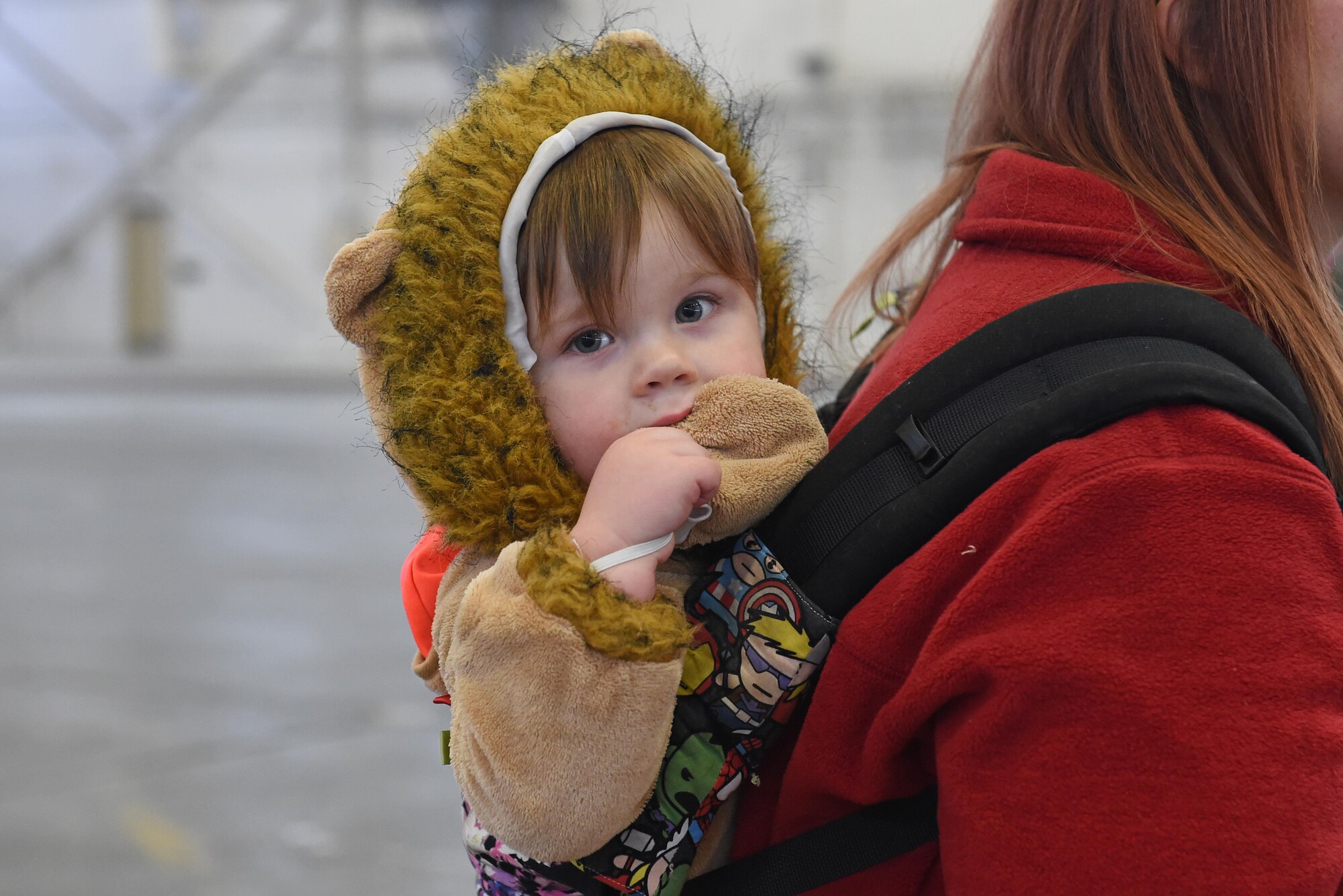 Aspen Styles, 1, watches his family as they participate in a costume fun run in Hangar 5 at Joint Base Elmendorf-Richardson, Alaska, Oct. 28, 2016. The run was a mile long and prizes were awarded to the top three finishers as well as best adult and child costumes. 